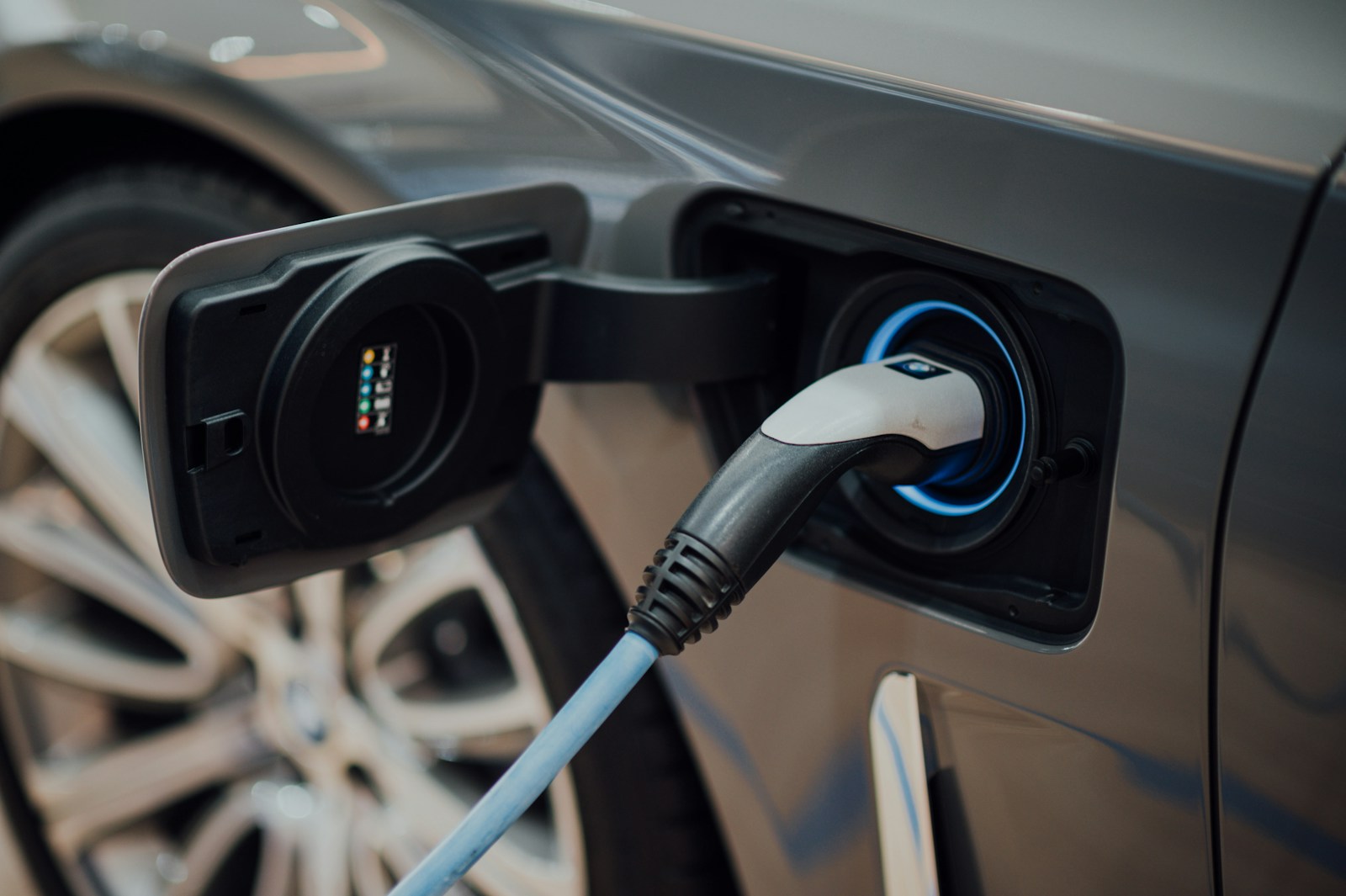 An electric-vehicle charging cable connected to a car